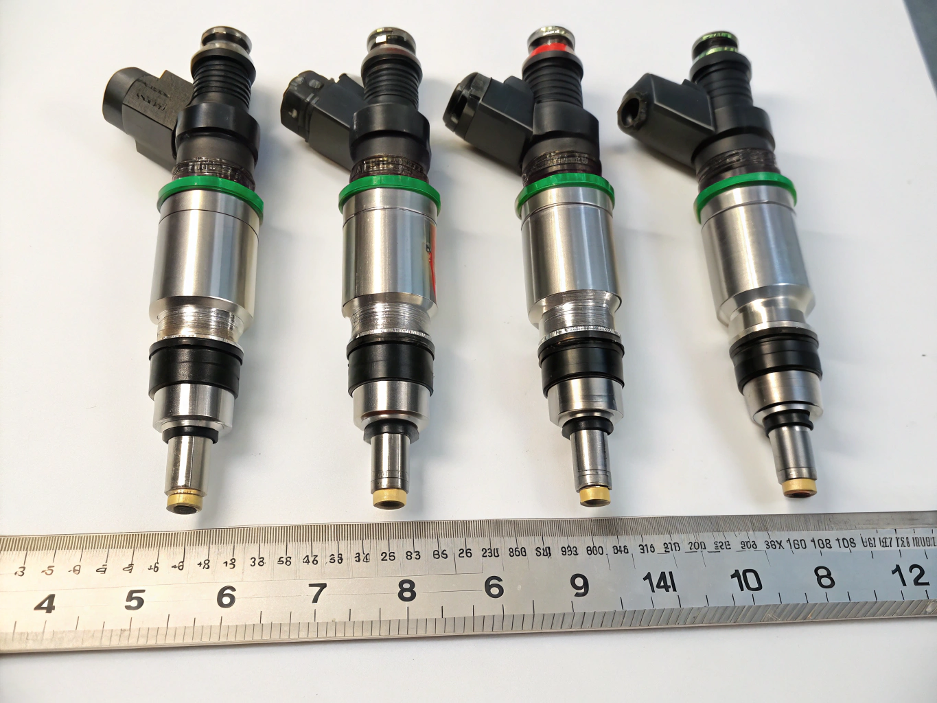 Automotive fuel injector set on clean shop bench